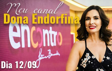 pracego: Fatima Bernardes ao lado do banner Programa Encontro com o texto Meu Canal Dona Endorfina no Encontro com Fátima Bernardes